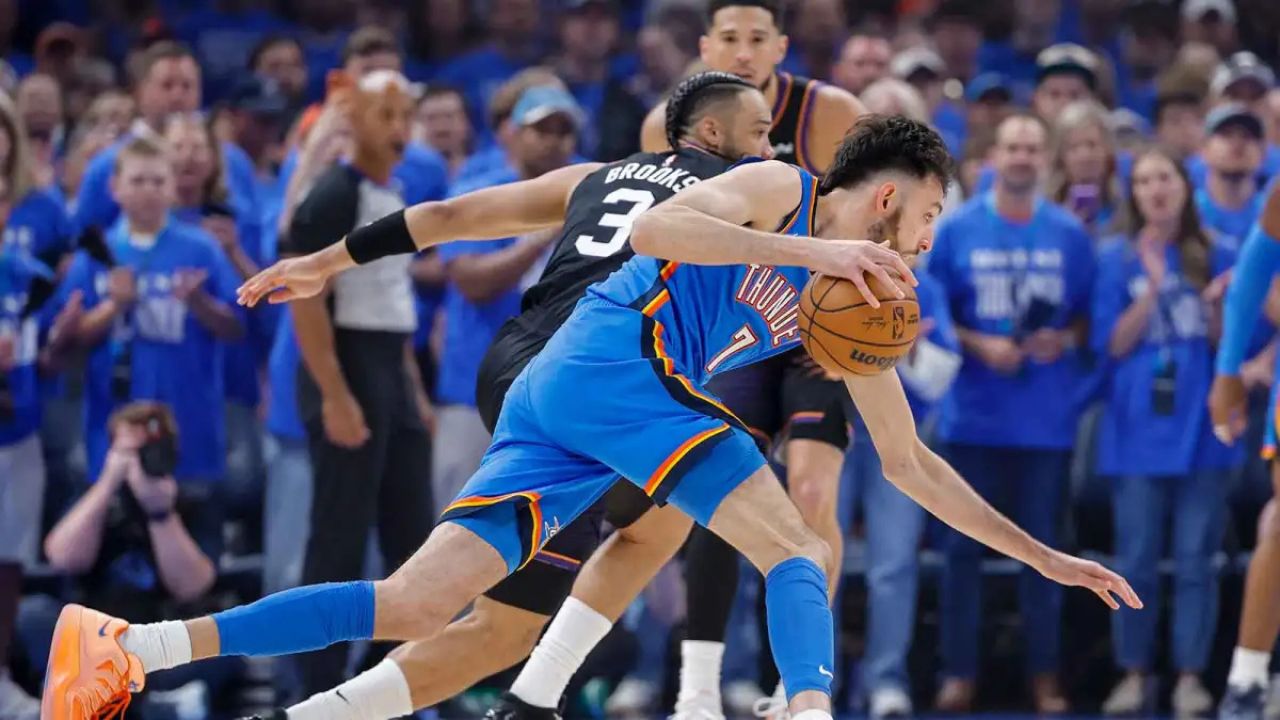 Apr 19, 2026; Oklahoma City, Oklahoma, USA; Oklahoma City Thunder center Chet Holmgren (7) drives around Phoenix Suns forward Dillon Brooks (3) in the first quarter during game one of the first round of the 2026 NBA Playoffs at Paycom Center. Mandatory Credit: Alonzo Adams-Imagn Images