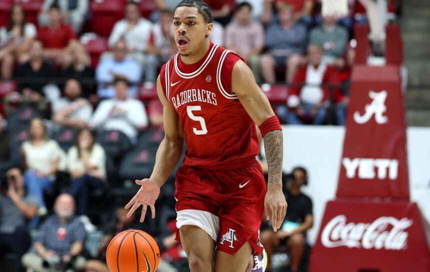 Feb 18, 2026; Tuscaloosa, Alabama, USA; Arkansas Razorback guard Darius Acuff Jr. (5) dribbles a fast break during the first half against the Alabama Crimson Tide at Coleman Coliseum. Mandatory Credit: David Leong-Imagn Images