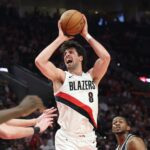 Apr 24, 2026; Portland, Oregon, USA; Portland Trail Blazers forward Deni Avdija (8) reacts after drawing a foul on San Antonio Spurs guard De'aaron Fox (4) during the first half during game three of the first round of the 2026 NBA Playoffs at Moda Center. Mandatory Credit: Jaime Valdez-Imagn Images