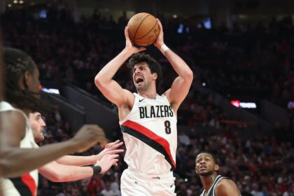 Apr 24, 2026; Portland, Oregon, USA; Portland Trail Blazers forward Deni Avdija (8) reacts after drawing a foul on San Antonio Spurs guard De'aaron Fox (4) during the first half during game three of the first round of the 2026 NBA Playoffs at Moda Center. Mandatory Credit: Jaime Valdez-Imagn Images