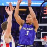 Apr 27, 2026; Orlando, Florida, USA; Orlando Magic guard Desmond Bane (3) shoots a three point basket against Detroit Pistons forward Duncan Robinson (55) during the second half during game four of the first round of the 2026 NBA Playoffs at Kia Center. Mandatory Credit: Mike Watters-Imagn Images