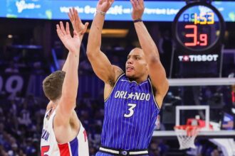 Apr 27, 2026; Orlando, Florida, USA; Orlando Magic guard Desmond Bane (3) shoots a three point basket against Detroit Pistons forward Duncan Robinson (55) during the second half during game four of the first round of the 2026 NBA Playoffs at Kia Center. Mandatory Credit: Mike Watters-Imagn Images