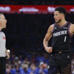 Apr 19, 2026; Oklahoma City, Oklahoma, USA; Phoenix Suns guard Devin Booker (1) talks to an official during a break in play against the Oklahoma City Thunder in the second quarter during game one of the first round of the 2026 NBA Playoffs at Paycom Center. Mandatory Credit: Alonzo Adams-Imagn Images