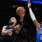 Jan 4, 2026; Phoenix, Arizona, USA; Phoenix Suns forward Dillon Brooks (3) drives to the basket against Oklahoma City Thunder guard Shai Gilgeous-Alexander (2) at Mortgage Matchup Center. Mandatory Credit: Mark J. Rebilas-Imagn Images