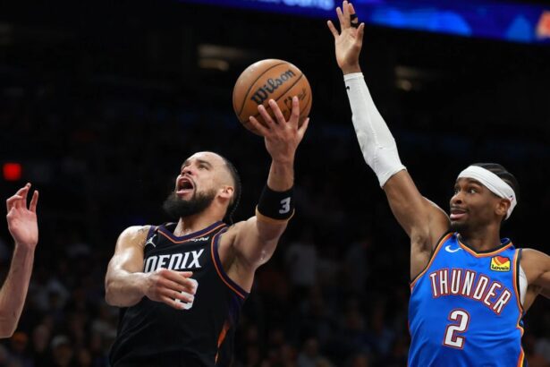 Jan 4, 2026; Phoenix, Arizona, USA; Phoenix Suns forward Dillon Brooks (3) drives to the basket against Oklahoma City Thunder guard Shai Gilgeous-Alexander (2) at Mortgage Matchup Center. Mandatory Credit: Mark J. Rebilas-Imagn Images