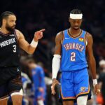 Apr 27, 2026; Phoenix, Arizona, USA; Oklahoma City Thunder guard Shai Gilgeous-Alexander (2) reacts alongside Phoenix Suns forward Dillon Brooks (3) in the first half during game four of the first round of the 2026 NBA Playoffs at Mortgage Matchup Center. Mandatory Credit: Mark J. Rebilas-Imagn Images