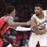 Apr 26, 2026; Houston, Texas, USA; Houston Rockets forward Jabari Smith Jr. (10) defends against Los Angeles Lakers guard Marcus Smart (36) during the third quarter during game four of the first round of the 2026 NBA Playoffs at Toyota Center. Mandatory Credit: Troy Taormina-Imagn Images