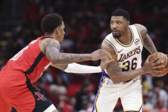 Apr 26, 2026; Houston, Texas, USA; Houston Rockets forward Jabari Smith Jr. (10) defends against Los Angeles Lakers guard Marcus Smart (36) during the third quarter during game four of the first round of the 2026 NBA Playoffs at Toyota Center. Mandatory Credit: Troy Taormina-Imagn Images