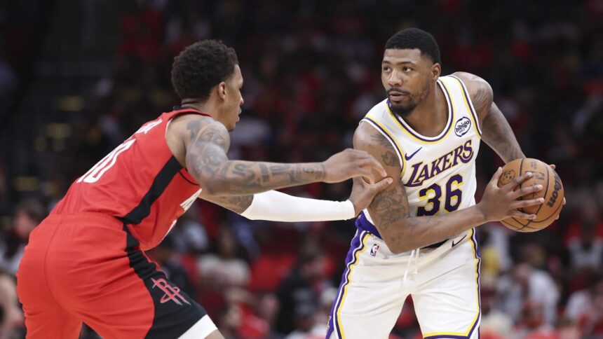 Apr 26, 2026; Houston, Texas, USA; Houston Rockets forward Jabari Smith Jr. (10) defends against Los Angeles Lakers guard Marcus Smart (36) during the third quarter during game four of the first round of the 2026 NBA Playoffs at Toyota Center. Mandatory Credit: Troy Taormina-Imagn Images