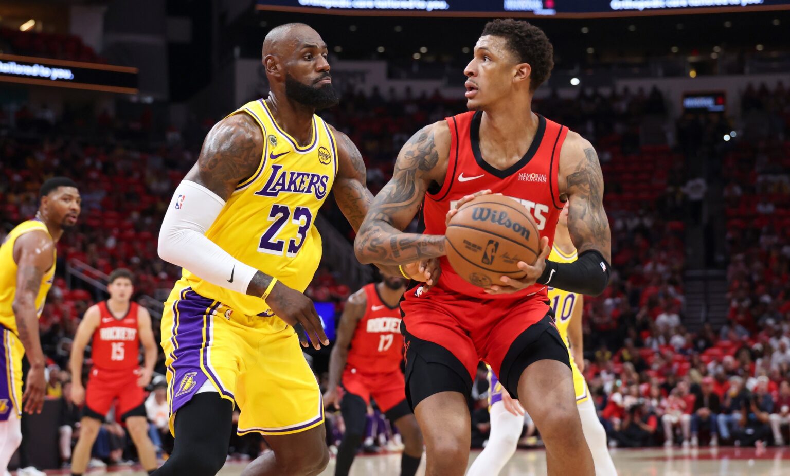 Apr 24, 2026; Houston, Texas, USA; Los Angeles Lakers forward LeBron James (23) defends against Houston Rockets forward Jabari Smith Jr. (10) during the first quarter during game three of the first round of the 2026 NBA Playoffs at Toyota Center. Mandatory Credit: Troy Taormina-Imagn Images