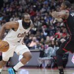 Apr 23, 2026; Toronto, Ontario, CAN; Cleveland Cavaliers guard James Harden (1) drives to the net against Toronto Raptors forward RJ Barrett (9) during the second half of game three of the first round of the 2026 NBA Playoffs at Scotiabank Arena. Mandatory Credit: John E. Sokolowski-Imagn Images