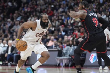 Apr 23, 2026; Toronto, Ontario, CAN; Cleveland Cavaliers guard James Harden (1) drives to the net against Toronto Raptors forward RJ Barrett (9) during the second half of game three of the first round of the 2026 NBA Playoffs at Scotiabank Arena. Mandatory Credit: John E. Sokolowski-Imagn Images
