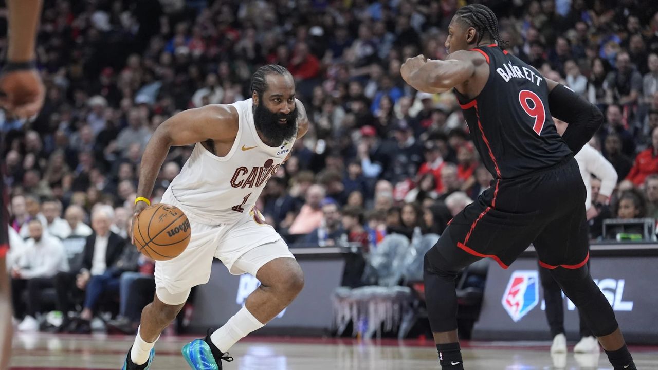 Apr 23, 2026; Toronto, Ontario, CAN; Cleveland Cavaliers guard James Harden (1) drives to the net against Toronto Raptors forward RJ Barrett (9) during the second half of game three of the first round of the 2026 NBA Playoffs at Scotiabank Arena. Mandatory Credit: John E. Sokolowski-Imagn Images