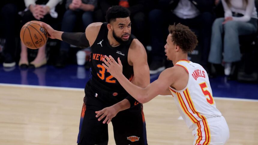 Apr 28, 2026; New York, New York, USA; New York Knicks center Karl-Anthony Towns (32) controls the ball against Atlanta Hawks guard Dyson Daniels (5) during the first quarter of game five of the first round of the 2026 NBA Playoffs at Madison Square Garden. Mandatory Credit: Brad Penner-Imagn Images