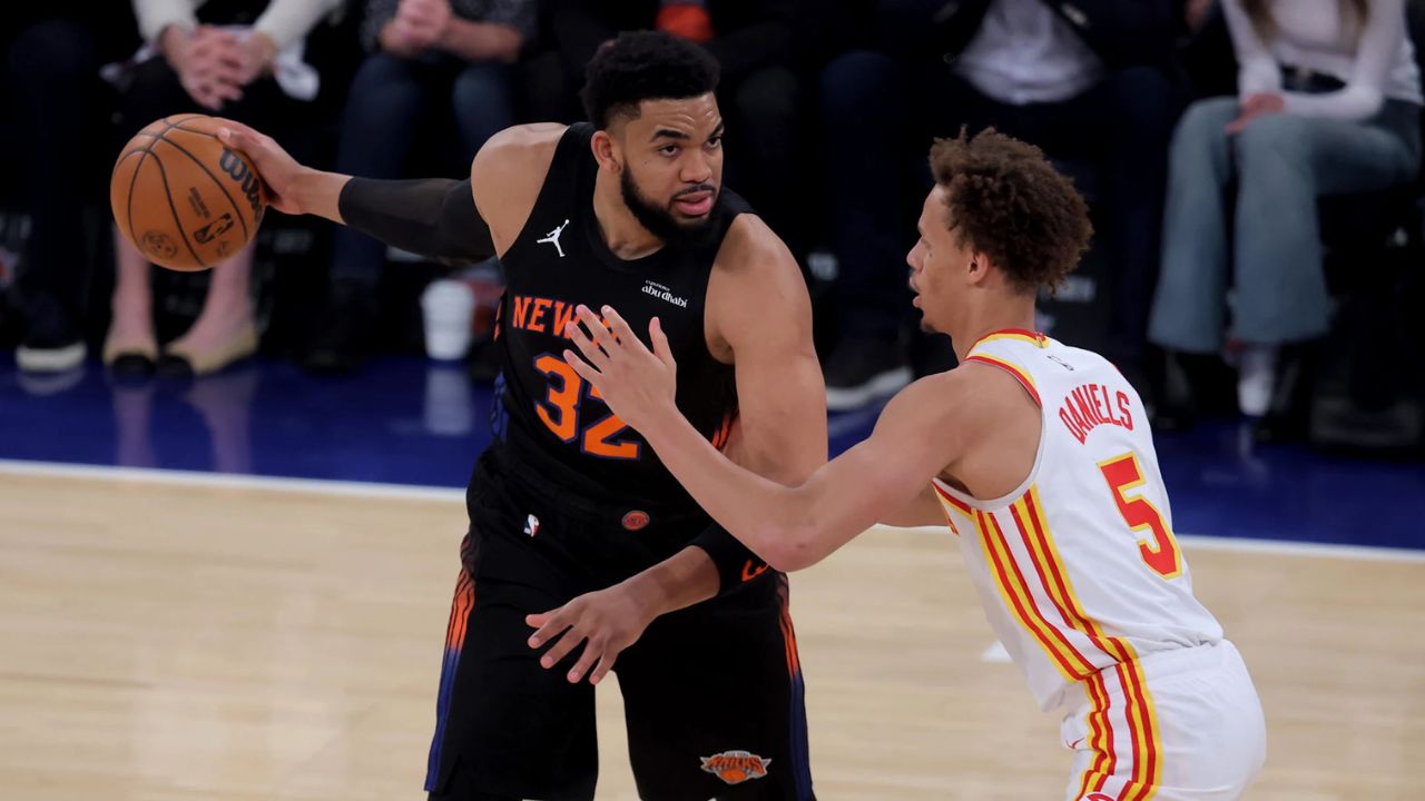 Apr 28, 2026; New York, New York, USA; New York Knicks center Karl-Anthony Towns (32) controls the ball against Atlanta Hawks guard Dyson Daniels (5) during the first quarter of game five of the first round of the 2026 NBA Playoffs at Madison Square Garden. Mandatory Credit: Brad Penner-Imagn Images