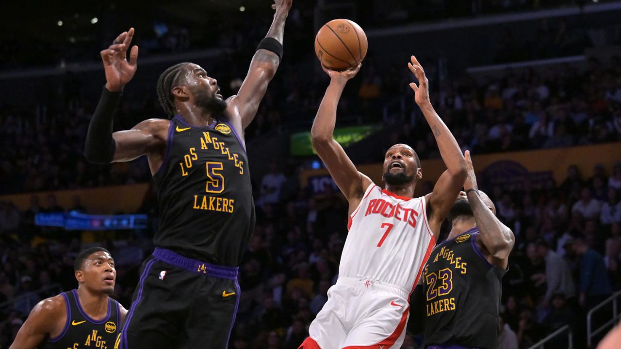 Apr 21, 2026; Los Angeles, California, USA; Houston Rockets forward Kevin Durant (7) is defended by Los Angeles Lakers center Deandre Ayton (5) as he drives to the basket during the second half of game two of the first round of the 2026 NBA Playoffs at Crypto.com Arena. Mandatory Credit: Jayne Kamin-Oncea-Imagn Images