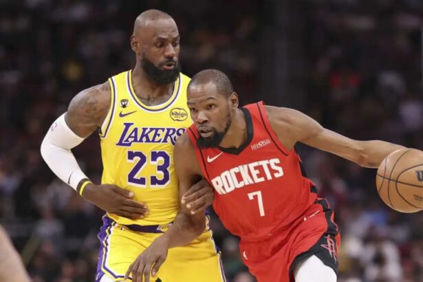 Mar 16, 2026; Houston, Texas, USA; Houston Rockets forward Kevin Durant (7) dribbles the ball as Los Angeles Lakers forward LeBron James (23) defends during the first quarter at Toyota Center. Mandatory Credit: Troy Taormina-Imagn Images