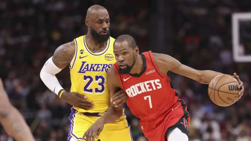 Mar 16, 2026; Houston, Texas, USA; Houston Rockets forward Kevin Durant (7) dribbles the ball as Los Angeles Lakers forward LeBron James (23) defends during the first quarter at Toyota Center. Mandatory Credit: Troy Taormina-Imagn Images