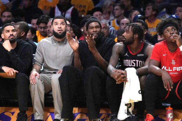Apr 18, 2026; Los Angeles, California, USA; Houston Rockets forward Kevin Durant (center) watches from the bench against the Los Angeles Lakers in the first half during game one of the first round of the 2026 NBA Playoffs at Crypto.com Arena. Mandatory Credit: Kirby Lee-Imagn Images