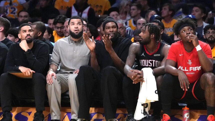 Apr 18, 2026; Los Angeles, California, USA; Houston Rockets forward Kevin Durant (center) watches from the bench against the Los Angeles Lakers in the first half during game one of the first round of the 2026 NBA Playoffs at Crypto.com Arena. Mandatory Credit: Kirby Lee-Imagn Images