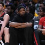 Apr 18, 2026; Los Angeles, California, USA; Houston Rockets center Alperen Sengun (28) and forward Kevin Durant (center) watch during the first half against the Los Angeles Lakers during game one of the first round of the 2026 NBA Playoffs at Crypto.com Arena. Mandatory Credit: Kirby Lee-Imagn Images