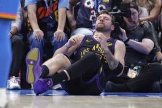 Apr 2, 2026; Oklahoma City, Oklahoma, USA; Los Angeles Lakers guard Luka Doncic (77) falls to the court during a play against the Oklahoma City Thunder during the third quarter at Paycom Center. Mandatory Credit: Alonzo Adams-Imagn Images