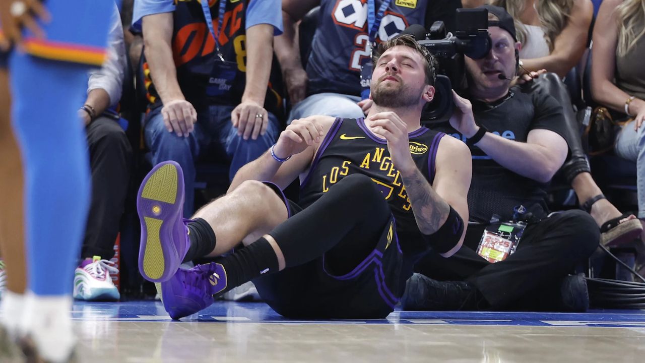 Apr 2, 2026; Oklahoma City, Oklahoma, USA; Los Angeles Lakers guard Luka Doncic (77) falls to the court during a play against the Oklahoma City Thunder during the third quarter at Paycom Center. Mandatory Credit: Alonzo Adams-Imagn Images