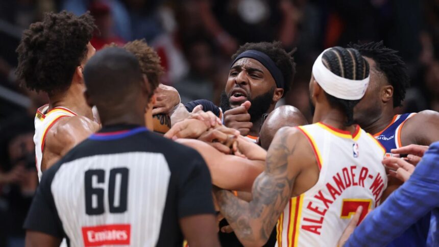 ATLANTA, GEORGIA - APRIL 30: Mitchell Robinson #23 of the New York Knicks and Jalen Johnson #1 of the Atlanta Hawks fight during the second quarter in Game Six of the First Round of the NBA Eastern Conference Playoffs at State Farm Arena on April 30, 2026 in Atlanta, Georgia. (Photo by Kevin C. Cox/Getty Images) (Kevin C. Cox via Getty Images)