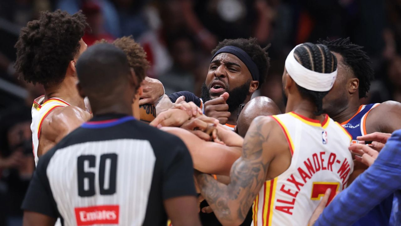 ATLANTA, GEORGIA - APRIL 30: Mitchell Robinson #23 of the New York Knicks and Jalen Johnson #1 of the Atlanta Hawks fight during the second quarter in Game Six of the First Round of the NBA Eastern Conference Playoffs at State Farm Arena on April 30, 2026 in Atlanta, Georgia. (Photo by Kevin C. Cox/Getty Images) (Kevin C. Cox via Getty Images)