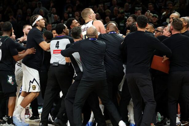 MINNEAPOLIS, MINNESOTA - APRIL 25: Members of the Denver Nuggets and Minnesota Timberwolves get into a scrum in the fourth quarter of Game Four of the First Round of the 2026 NBA Western Conference Playoffs at Target Center on April 25, 2026 in Minneapolis, Minnesota. Nikola Jokic #15 of the Denver Nuggets and Julius Randle #30 of the Minnesota Timberwolves were ejected from the game. The Timberwolves defeated the Nuggets 112-96. (Photo by David Berding/Getty Images)