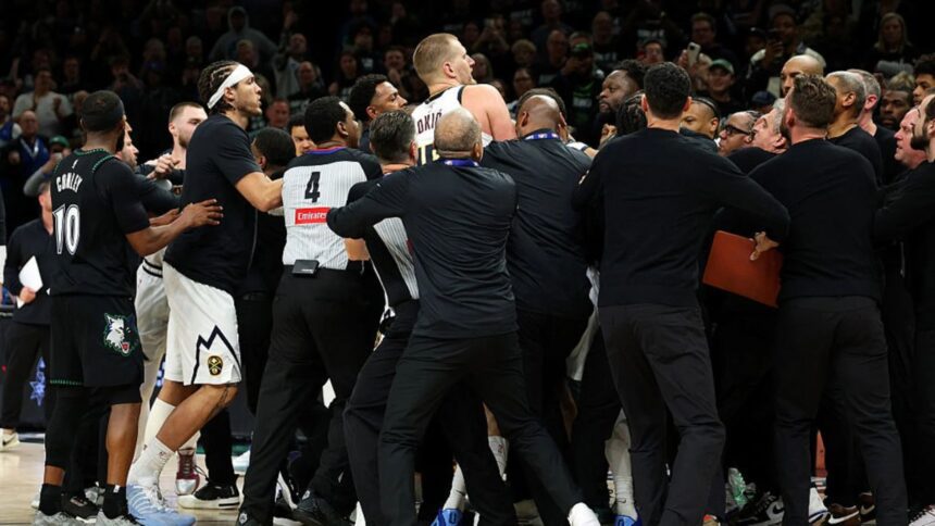MINNEAPOLIS, MINNESOTA - APRIL 25: Members of the Denver Nuggets and Minnesota Timberwolves get into a scrum in the fourth quarter of Game Four of the First Round of the 2026 NBA Western Conference Playoffs at Target Center on April 25, 2026 in Minneapolis, Minnesota. Nikola Jokic #15 of the Denver Nuggets and Julius Randle #30 of the Minnesota Timberwolves were ejected from the game. The Timberwolves defeated the Nuggets 112-96. (Photo by David Berding/Getty Images)