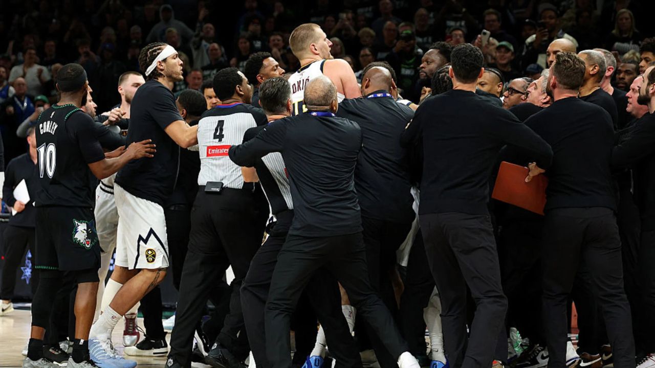 MINNEAPOLIS, MINNESOTA - APRIL 25: Members of the Denver Nuggets and Minnesota Timberwolves get into a scrum in the fourth quarter of Game Four of the First Round of the 2026 NBA Western Conference Playoffs at Target Center on April 25, 2026 in Minneapolis, Minnesota. Nikola Jokic #15 of the Denver Nuggets and Julius Randle #30 of the Minnesota Timberwolves were ejected from the game. The Timberwolves defeated the Nuggets 112-96. (Photo by David Berding/Getty Images)