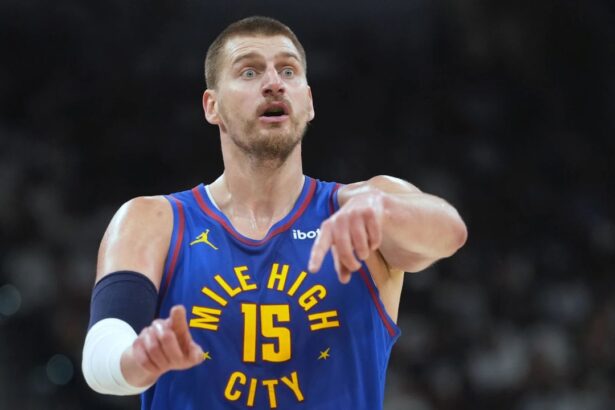 Apr 12, 2026; San Antonio, Texas, USA; Denver Nuggets center Nikola Jokic (15) signals to teammates during the first half against the San Antonio Spurs at Frost Bank Center. Mandatory Credit: Scott Wachter-Imagn Images