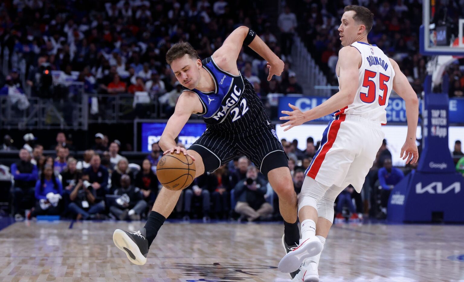 Apr 19, 2026; Detroit, Michigan, USA; Orlando Magic forward Franz Wagner (22) is fouled by Detroit Pistons guard Duncan Robinson (55) in the first half during the 2026 NBA Playoffs at Little Caesars Arena. Mandatory Credit: Rick Osentoski-Imagn Images