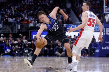 Apr 19, 2026; Detroit, Michigan, USA; Orlando Magic forward Franz Wagner (22) is fouled by Detroit Pistons guard Duncan Robinson (55) in the first half during the 2026 NBA Playoffs at Little Caesars Arena. Mandatory Credit: Rick Osentoski-Imagn Images