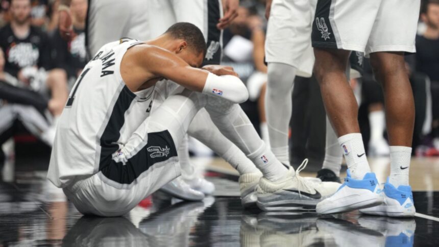 Apr 21, 2026; San Antonio, Texas, USA; San Antonio Spurs forward Victor Wembanyama (1) reacts after falling to the ground during the first half of game two of the first round of the 2026 NBA Playoffs against the Portland Trail Blazers at Frost Bank Center. Mandatory Credit: Scott Wachter-Imagn Images