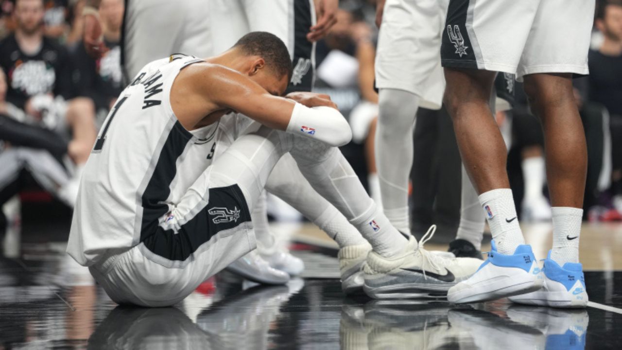 Apr 21, 2026; San Antonio, Texas, USA; San Antonio Spurs forward Victor Wembanyama (1) reacts after falling to the ground during the first half of game two of the first round of the 2026 NBA Playoffs against the Portland Trail Blazers at Frost Bank Center. Mandatory Credit: Scott Wachter-Imagn Images