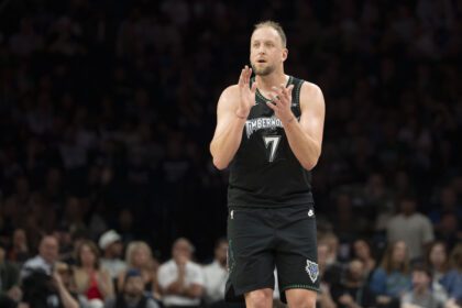 Minnesota Timberwolves forward Joe Ingles (7) claps after making a shot against the New Orleans Pelicans in the second half at Target Center.
