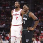 Houston Rockets forward Kevin Durant (7) talks with Minnesota Timberwolves guard Anthony Edwards (5) during the third quarter at Toyota Center.