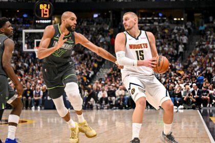 DENVER , CO - APRIL 18: Nikola Jokic (15) of the Denver Nuggets handles as Rudy Gobert (27) of the Minnesota Timberwolves defends during the fourth quarter of the Nuggets' 116-105 win at Ball Arena in Denver, Colorado on Saturday, April 18, 2026. The Nuggets took a 1-0 lead in their best-of-seven series. (Photo by AAron Ontiveroz/The Denver Post)