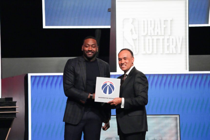 Mark Tatum the NBA Deputy Commissioner and Washington Wizard (left) guard John Wall pose for photos after Wizards won the 2026 NBA Draft Lottery at Navy Pier.