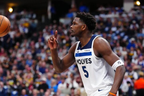 Apr 20, 2026; Denver, Colorado, USA; Minnesota Timberwolves guard Anthony Edwards (5) calls for a replay in the first half against the Denver Nuggets during game two of the first round of the 2026 NBA Playoffs at Ball Arena. Mandatory Credit: Ron Chenoy-Imagn Images