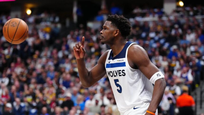 Apr 20, 2026; Denver, Colorado, USA; Minnesota Timberwolves guard Anthony Edwards (5) calls for a replay in the first half against the Denver Nuggets during game two of the first round of the 2026 NBA Playoffs at Ball Arena. Mandatory Credit: Ron Chenoy-Imagn Images