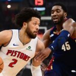 May 11, 2026; Cleveland, Ohio, USA; Detroit Pistons guard Cade Cunningham (2) drives to the basket against Cleveland Cavaliers guard Donovan Mitchell (45) during the first half of game four in the second round of the 2026 NBA Playoffs at Rocket Arena. Mandatory Credit: Ken Blaze-Imagn Images