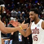 Jan 8, 2025; Cleveland, Ohio, USA; Cleveland Cavaliers guard Donovan Mitchell (45) celebrates with center Jarrett Allen (31) after the Cavaliers beat the Oklahoma City Thunder at Rocket Mortgage FieldHouse. Mandatory Credit: Ken Blaze-Imagn Images