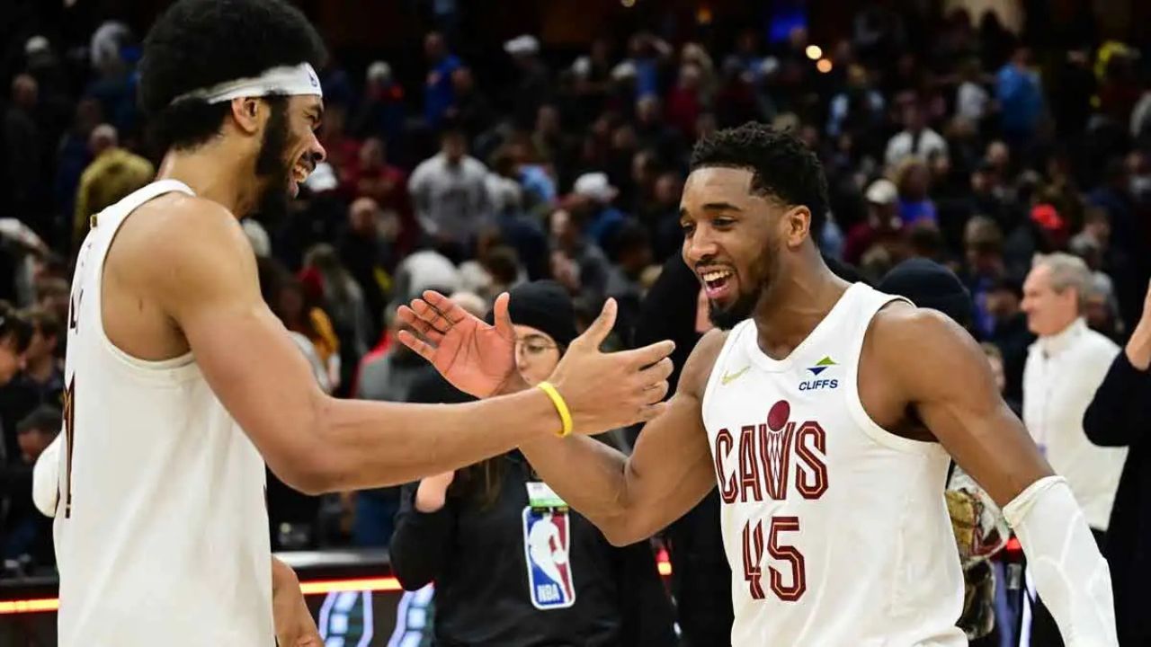 Jan 8, 2025; Cleveland, Ohio, USA; Cleveland Cavaliers guard Donovan Mitchell (45) celebrates with center Jarrett Allen (31) after the Cavaliers beat the Oklahoma City Thunder at Rocket Mortgage FieldHouse. Mandatory Credit: Ken Blaze-Imagn Images