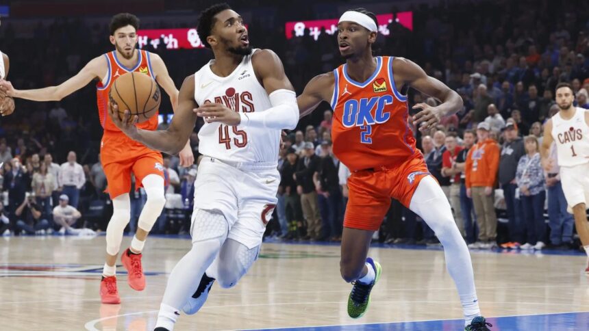 Nov 8, 2023; Oklahoma City, Oklahoma, USA; Cleveland Cavaliers guard Donovan Mitchell (45) drives to the basket against Oklahoma City Thunder guard Shai Gilgeous-Alexander (2) during the first quarter at Paycom Center. Mandatory Credit: Alonzo Adams-Imagn Images