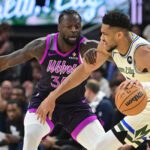 Milwaukee Bucks forward Giannis Antetokounmpo (34) drives for the basket against Minnesota Timberwolves forward Julius Randle (30) in the first quarter at Fiserv Forum.