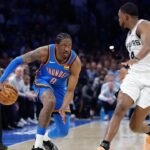 Jan 13, 2026; Oklahoma City, Oklahoma, USA; Oklahoma City Thunder guard/forward Jalen Williams (8) drives down the court beside San Antonio Spurs guard De'aaron Fox (4) during the second half at Paycom Center. Mandatory Credit: Alonzo Adams-Imagn Images