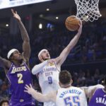 Nov 12, 2025; Oklahoma City, Oklahoma, USA; Oklahoma City Thunder guard Alex Caruso (9) goes up for a basket beside Los Angeles Lakers forward Jarred Vanderbilt (2) during the second quarter at Paycom Center. Mandatory Credit: Alonzo Adams-Imagn Images